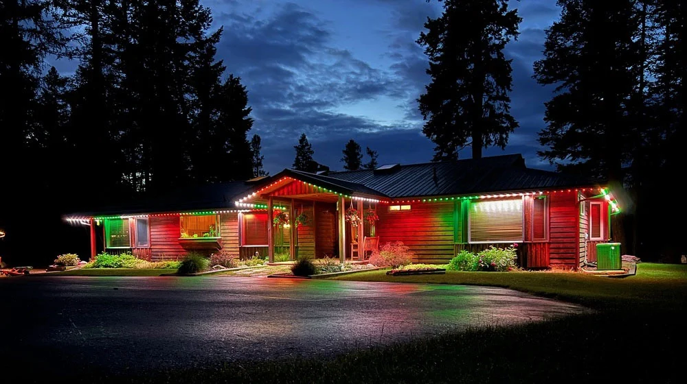 Priddis acreage with Christmas red and green permanent lights